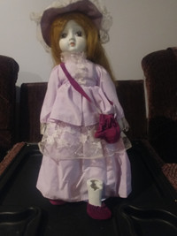 Purple dress suit porcelain doll broken leg