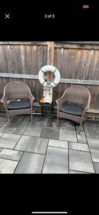 2 wicker lawn chairs with table