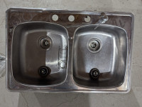 Stainless steel double sink with dispenser
