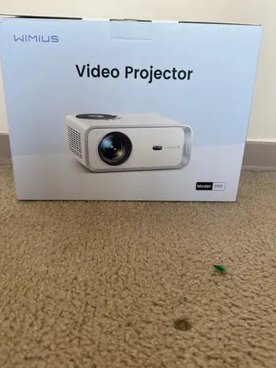 Portable projector in good working condition. Perfect for watching movies, shows, or connecting to a...