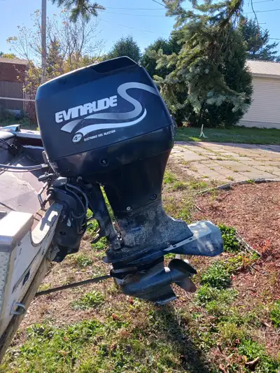 $600 1999 70HP Evanrude 4 Stroke New Seats Boat leaks, motor runs good Trailer included Selling as i...