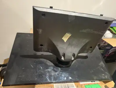 This used black LG TV stand is designed for stability and support for your television. It shows sign...