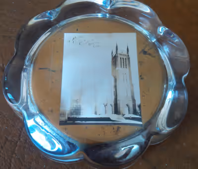 The picture is a bit faded. The scalloped edges paper weight measures 3.25" in diameter. Buy from mo...