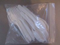 bag of plastic forks and spoons