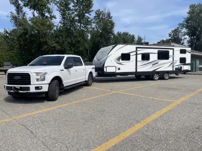 Double-over-double rear bunks Private front bedroom with queen bed Large slide with dinette and couc...
