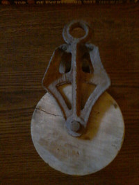 I have an antique wood and cast iron pulley (early) for sale.