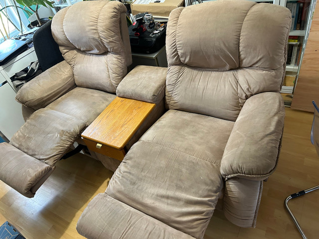 Good condition recliner love seat with table, rocks and reclines in Chairs & Recliners in Oakville / Halton Region