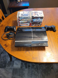 PS3 with 2 controllers and 20 games