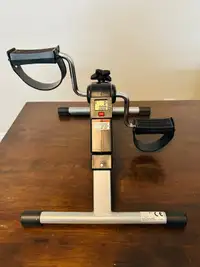 Folding exercise peddler with electronic display 