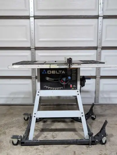 Delta table saw. Works great. Comes with stand and dolly cart. Also comes with dado blade.