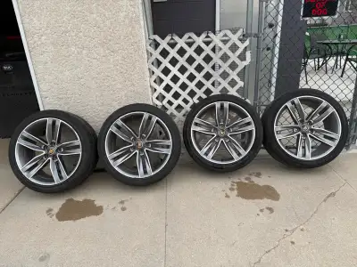 Camaro wheels with Cadillac emblems taped overtop of bow tie center caps 245 40R20 tires with 5x120...