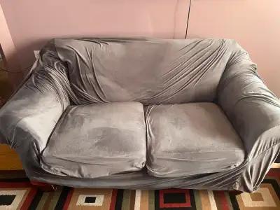 This charming 2 seater red sofa is ready for a new home! It's perfect for cozying up in a small spac...