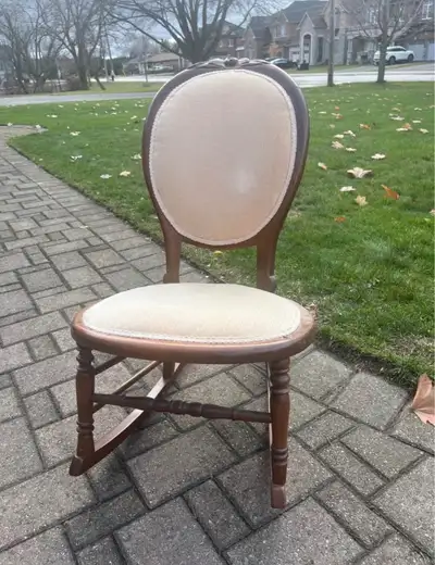 Victorian-Style Upholstered Antique Rocking Chair >Oval-back design with cream/beige upholstery >Dar...
