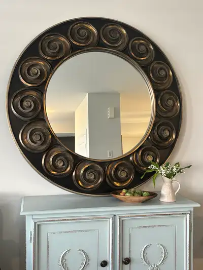 This mirror is uniquely style that provides a statement piece for your home. Dimenson: 48”