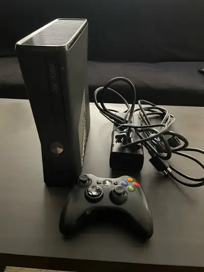 Xbox 360 Slim complete with 4 games, View more