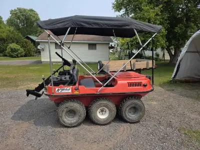 Argo including canopy with side walls, 86 thrust Newport electric motor with 2 12 volt batteries, wi...