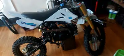 100 cc pit bike was riding it in summer needs a coil I have the old one it still works but some bare...