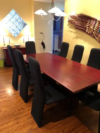 Dining Room Set with 8 chairs and side board The table measures 84 inches by 40 inches and stands 29...