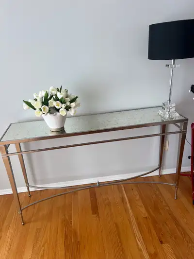 This is a beautiful console or sofa table. It is metal with a mirrored top. Excellent condition very...