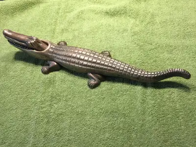 This nut cracker measures 14.5 inches in length. It is made of solid bronze (marking underneath). It...