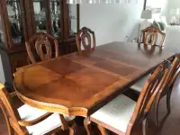 Dining room table and matching hutch with 6 chairs