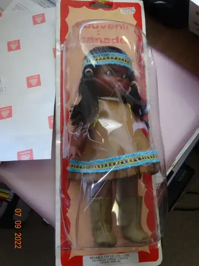 It appears the doll was created - a 9inch native girl in leather dress, long leggings, headband and...