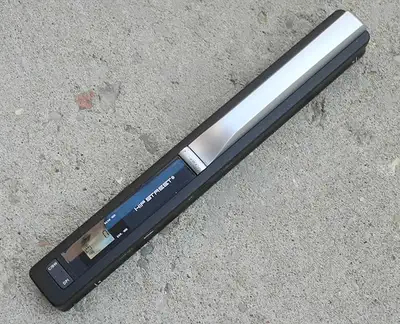 Small. light, portable document scanner, works with 2xAA batteries or USB. It is like a magic wand,...