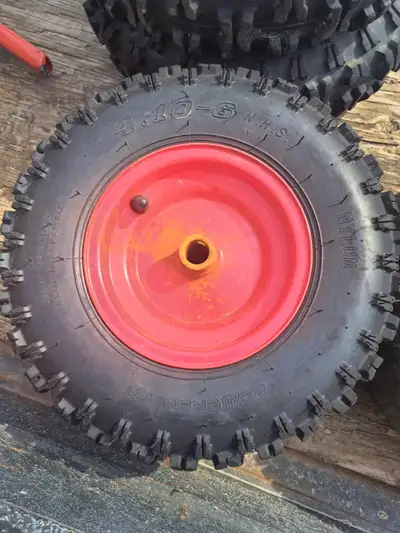 There are two pairs of turf and snowblower tires on rims. The yellow 4 bolt 23-9.5-12's are $40, the...