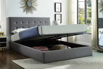 This upholstered storage bed is the perfect combination of style and functionality, featuring a slee...