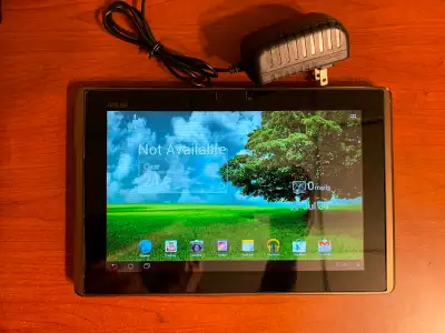 Asus Eee Pad Transformer TF101, 10 inch tablet with power adapter, fair condition.