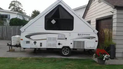 2012 Rockwood A122 hard-side, pop-up camper manufactured by Forest River, known for its A-frame desi...