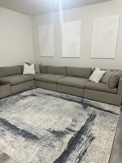 This ad is for the RUG. Not the couch. 7’10” x 10’10” Large beautiful abstract rug from Turkey. Beig...