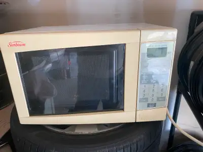 Sundeam used microwave, in good condition, 18 inch long 13 width 11 high, pick up in St Catharines,...