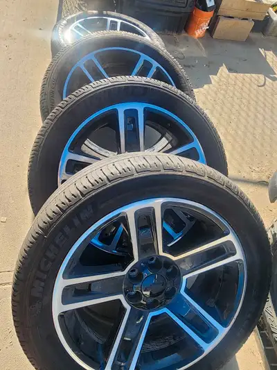 Chevy half ton 1500 rims and tires off high country rims tires very good condition. Working tpm sens...