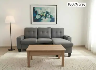 This is a used grey sectional sofa that comfortably seats three people, featuring a chaise lounge on...