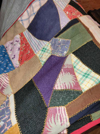 A bunch of quilts varying in make and quality.