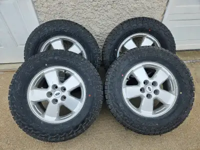 4 Falken wildpeak A/T 4w tires on Ford OEM alloy rims in excellent condition TPMS installed 13/32 tr...