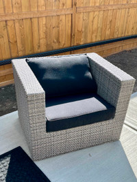 Two all weather wicker club chairs grey with black cushions