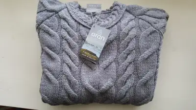 Pure merino wool Aran cable knit pullovers offered from an estate sale. Soft to the touch. Hand wash...