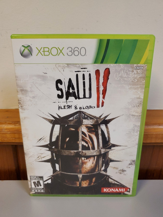 Saw II (2) Flesh & Blood Xbox 360 PAL Complete With Manual | XBOX 360 | St.  Catharines | Kijiji