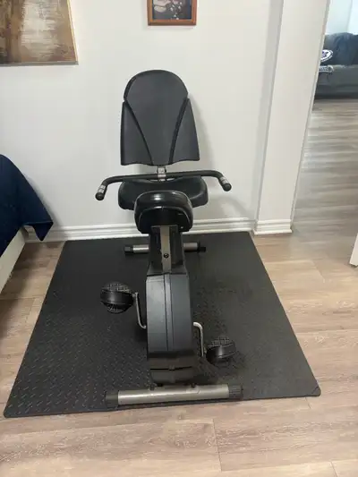 Get moving with this Universal 855 recumbent exercise bike, perfect for low-impact cardio workouts i...