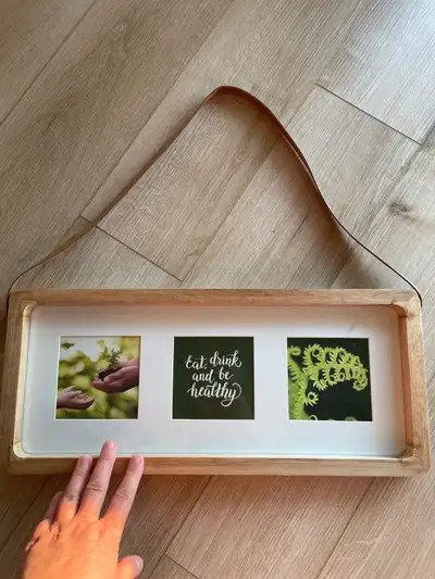 Brand new picture frame that I purchased from HomeSense and never used. Has a leather strap. Holds T...