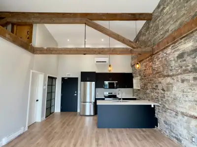 Beautifully restored 1846 stone building blending historic character with modern luxury. Steps to sh...