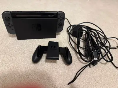 This is the standard (non-OLED) version of the Nintendo Switch. The console is in very good conditio...
