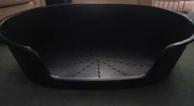 Plastic dog bed oval 40" x26" x 9". Good condition. Price is firm. If ad is up it is available.