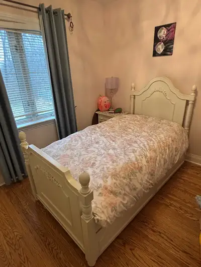 Bed size: twin Solid wood bed frame and nightstand Trundle bed that can fit an extra twin mattress o...