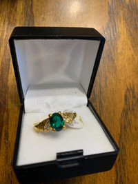size 8 14K plated ring (with emerald colored stone); new