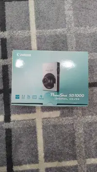 Canon PowerShot Digital ELPH SD1000 7.1MP Digital Came
