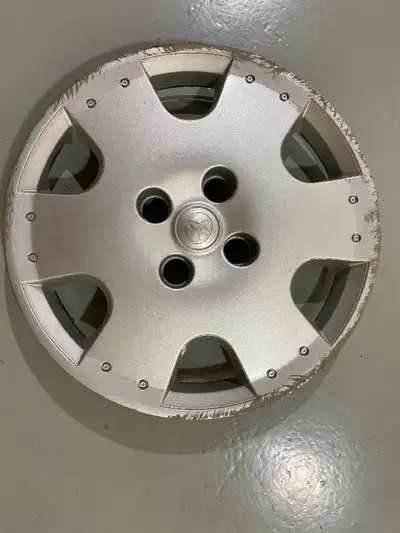 Looking for 1-4 hubcaps for above car.