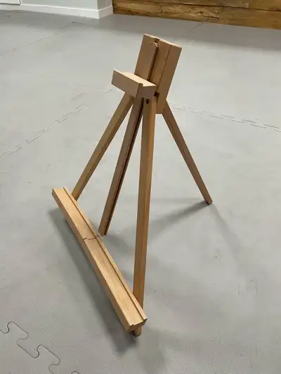 Painting easel. For painting or displaying your art work. Wooden, adjustable arm, folds for easy sto...